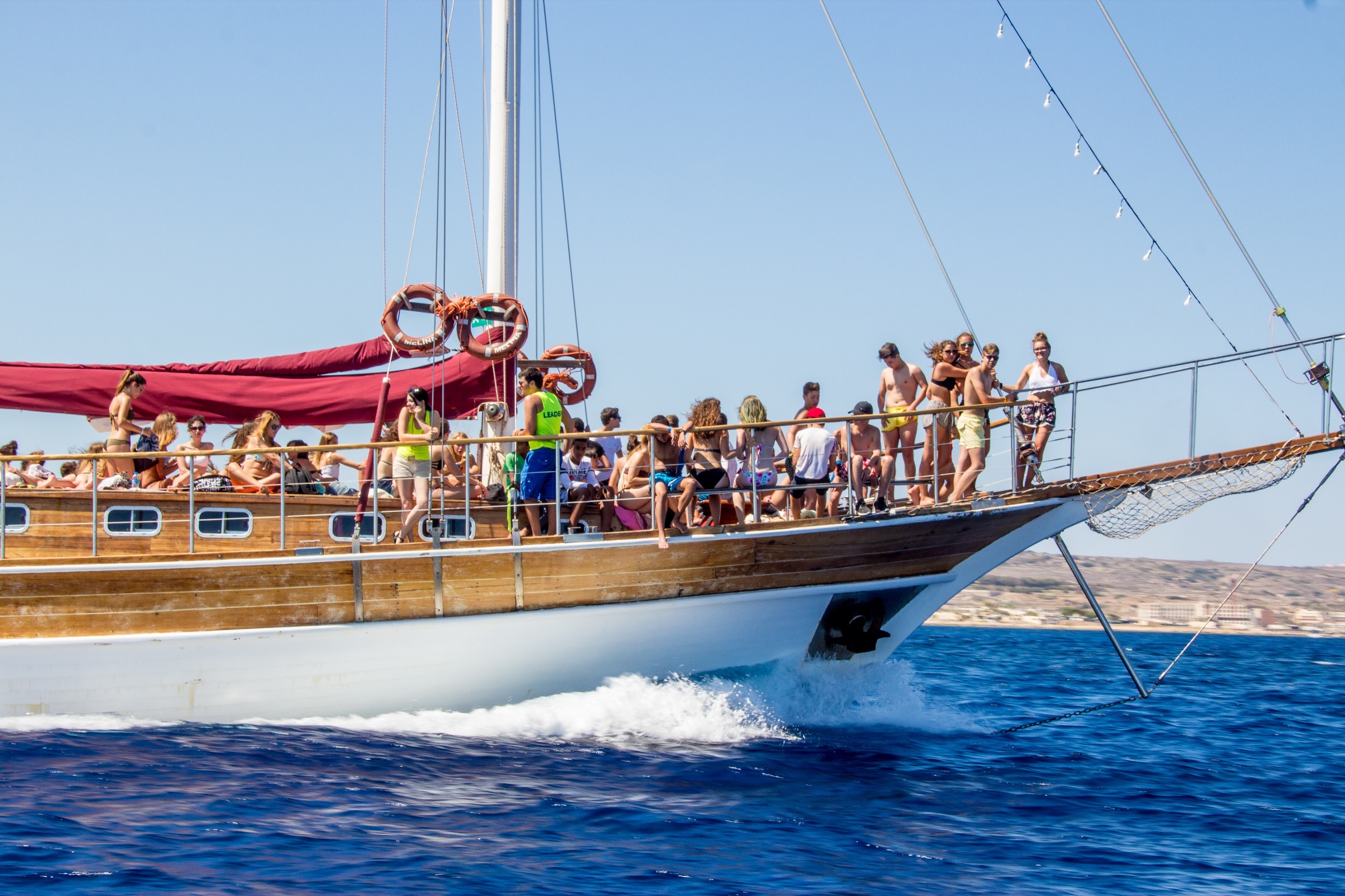 Junior students enjoying a boat trip excursion along Malta's coastline during a language course