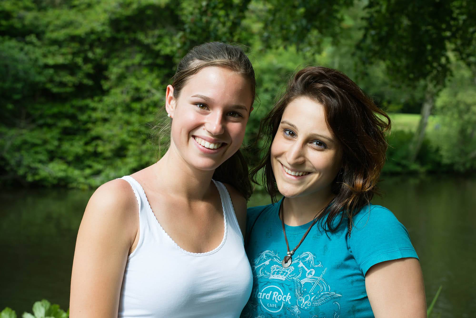 Two smiling adult students enjoying a riverside outing during an Ireland ISI language course