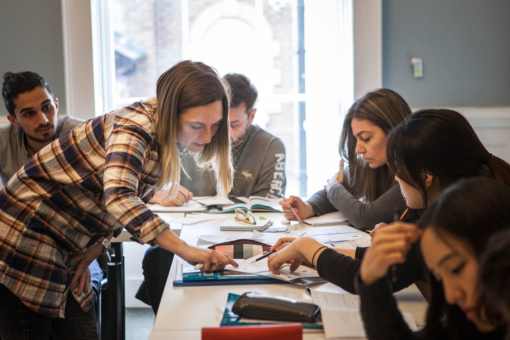 Adult students collaborating on an English exercise during class at ISI Parnell Square Dublin