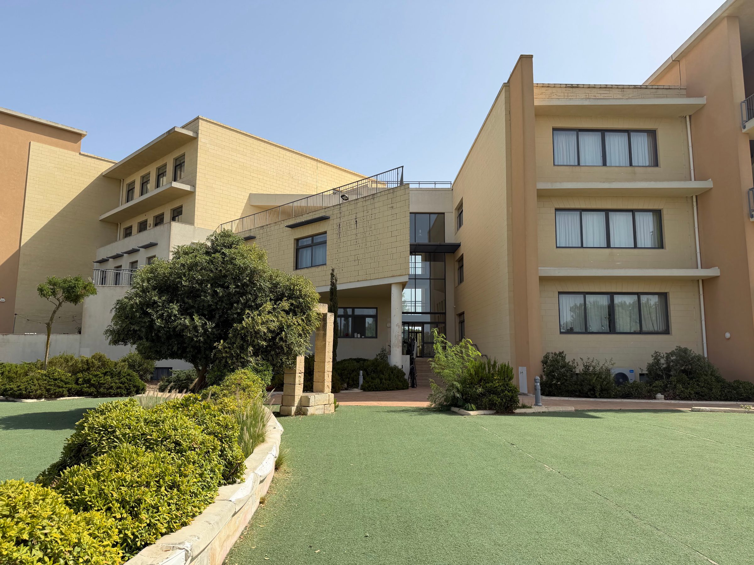 Junior summer camp residence building in Malta with landscaped garden and entrance courtyard